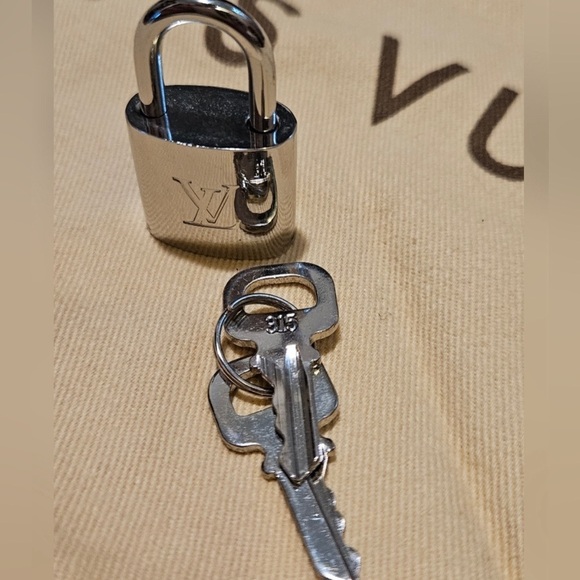 Louis Vuitton Handbags - Louis Vuitton Silver Tone Lock and Keys 315